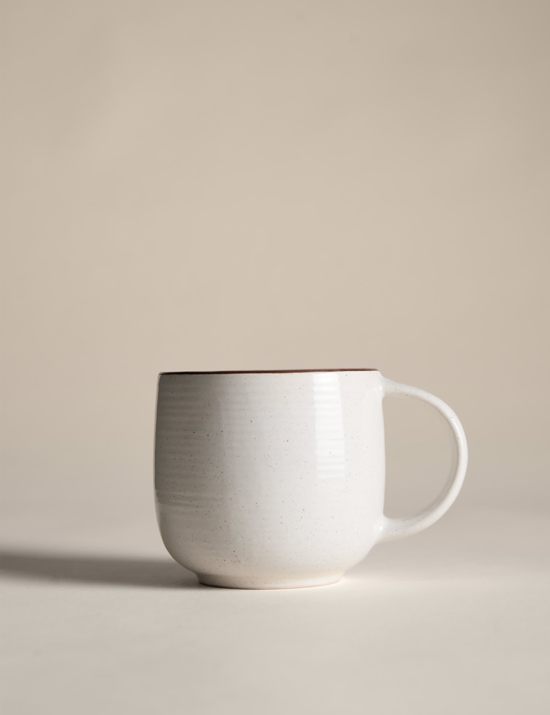 Set of four speckled ceramic mugs with contrast rims - British product