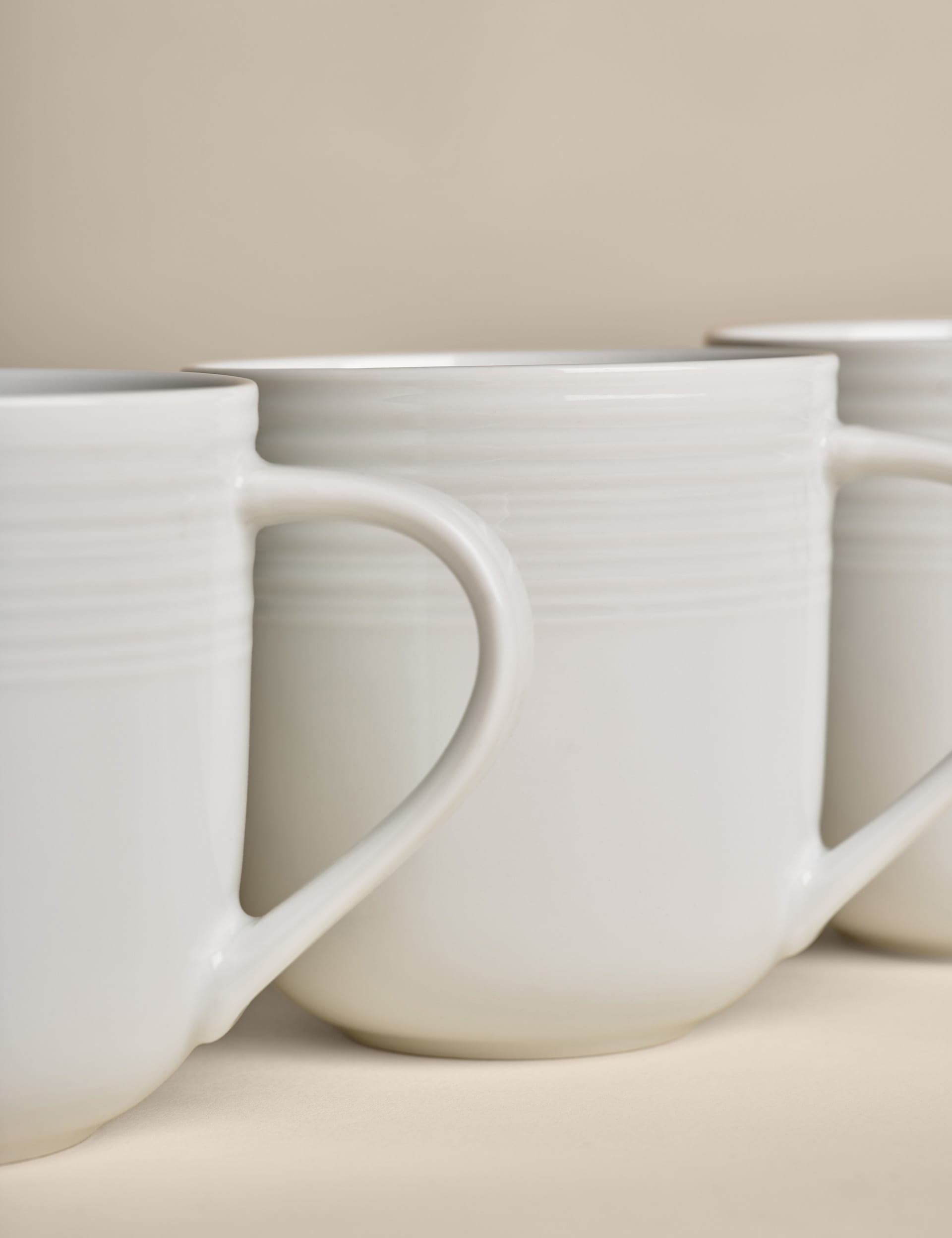 Set of four ribbed porcelain mugs (British brand)