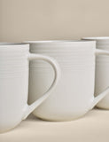 Set of four ribbed porcelain mugs (British brand)
