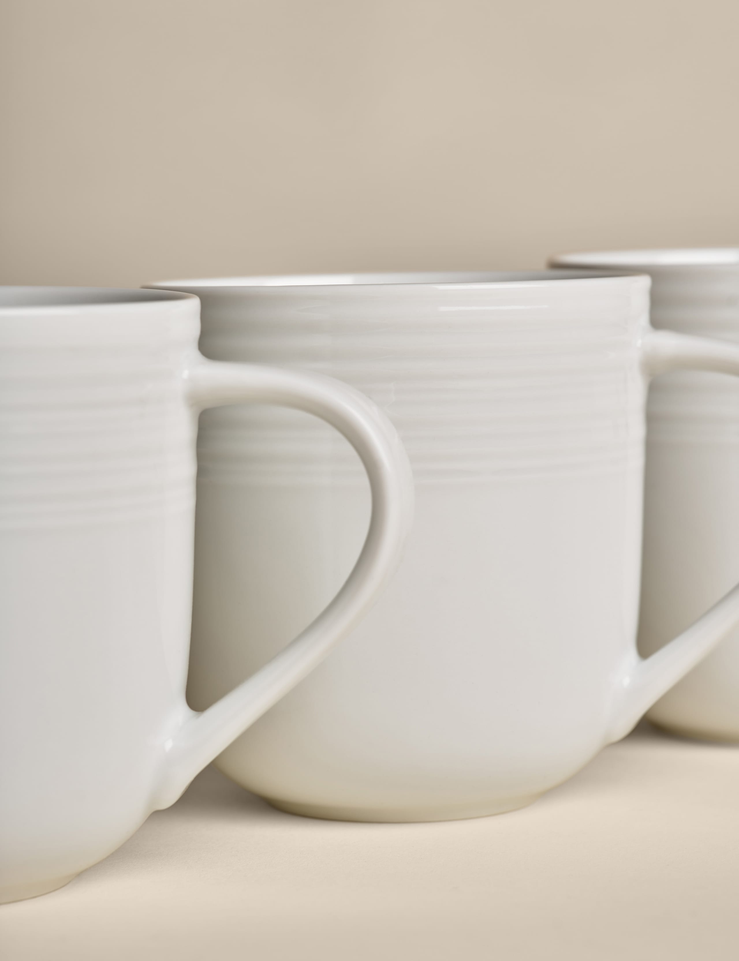 Set of four ribbed porcelain mugs (British brand)