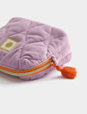 Small quilted toiletry bag with cotton exterior and tassel zip (British brand)