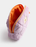 Small quilted toiletry bag with cotton exterior and tassel zip (British brand)