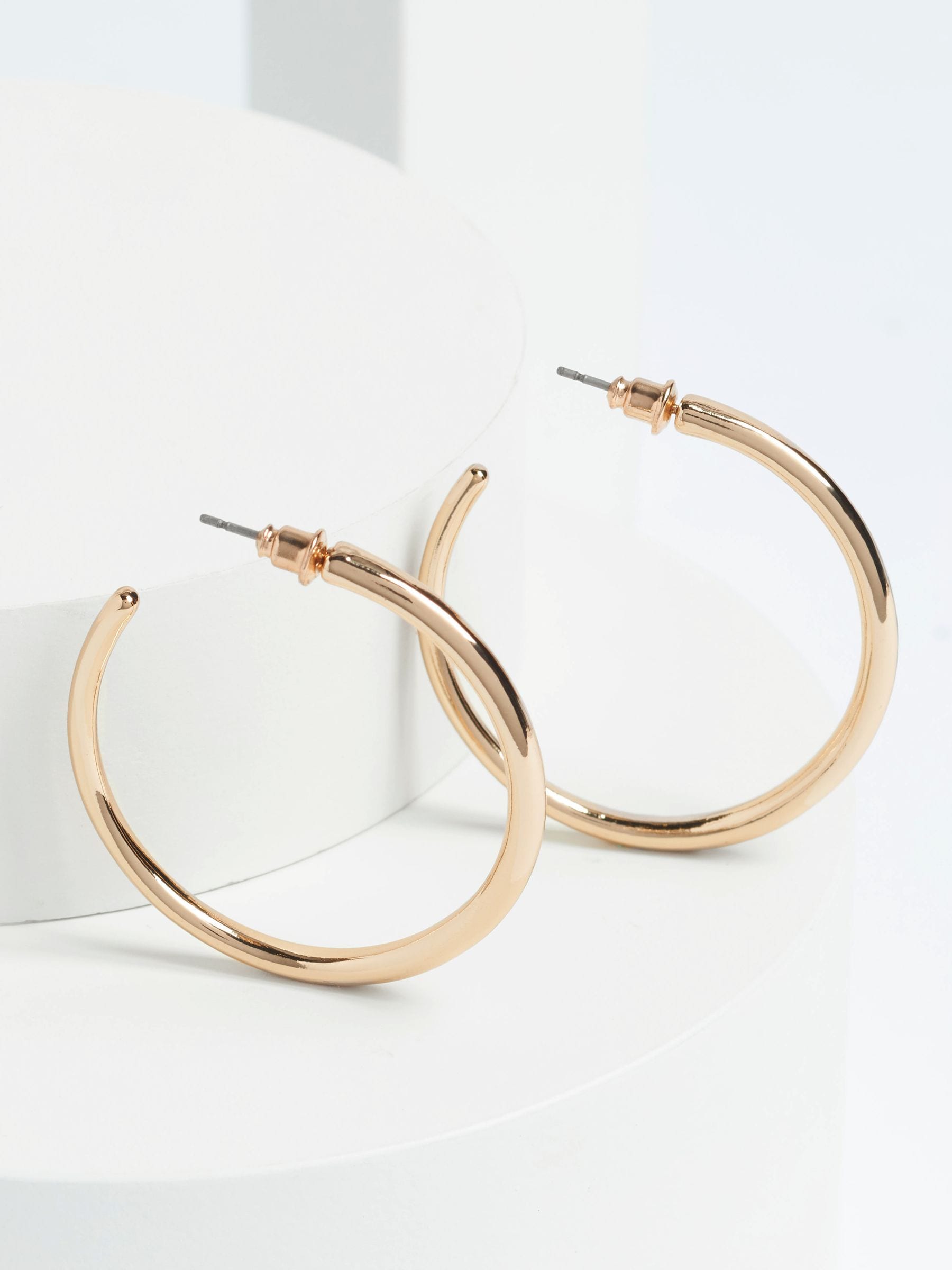 Gold tone taper hoop earrings, UK version