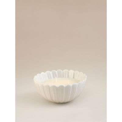 George Home daisy shaped candle with jasmine and amber (British brand)