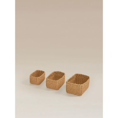 Three natural brown woven baskets, imported from the UK