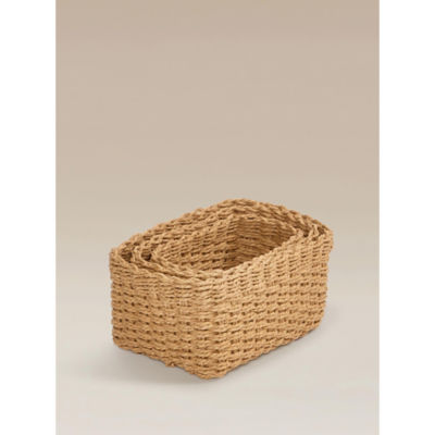 Three natural brown woven baskets, imported from the UK