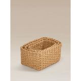 Three natural brown woven baskets, imported from the UK