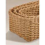 Three natural brown woven baskets, imported from the UK