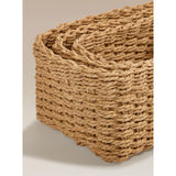 Three natural brown woven baskets, imported from the UK