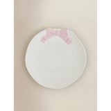 Dinner plate with pink and white bow design, imported from the UK