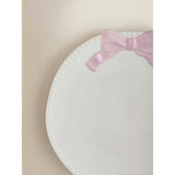 Dinner plate with pink and white bow design, imported from the UK