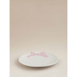 Stoneware side plate with pink and white bow design, imported from the UK