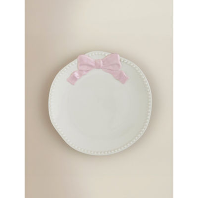 Stoneware side plate with pink and white bow design, imported from the UK
