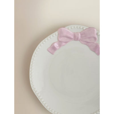 Stoneware side plate with pink and white bow design, imported from the UK