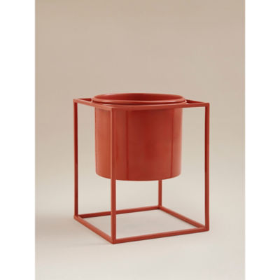 Red metal planter with geometric steel stand - British product