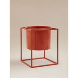 Red metal planter with geometric steel stand - British product