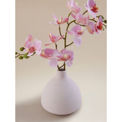Pink artificial orchids in stripe vase, UK version