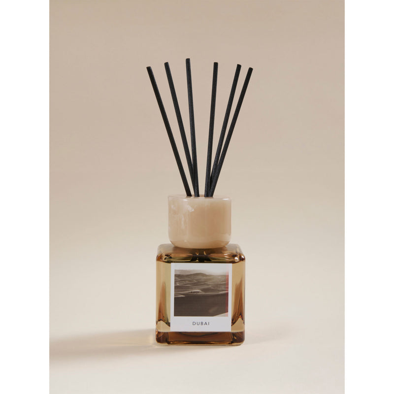 Dubai reed diffuser with raspberry and peppercorn scent, glass vessel - British product