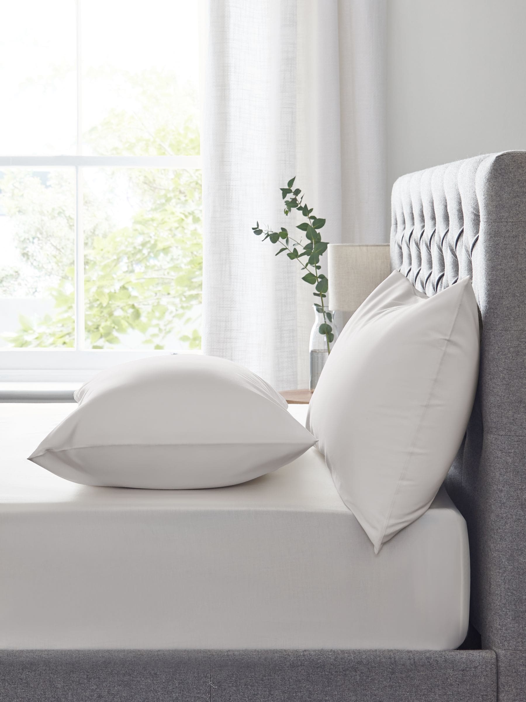 Natural easy-care polycotton fitted sheet, imported from the UK