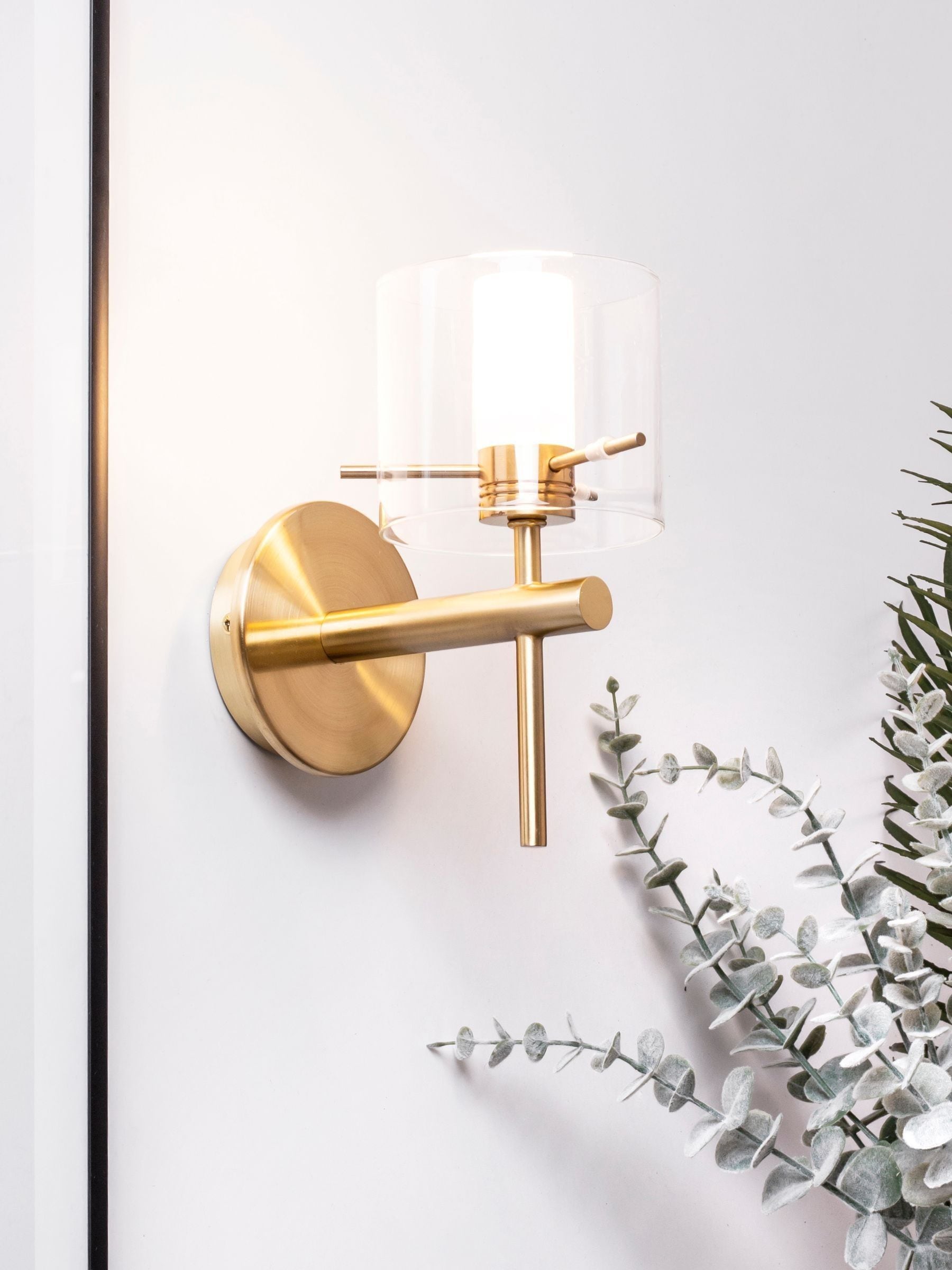 Brass Gene cylinder bathroom wall light, imported from the UK