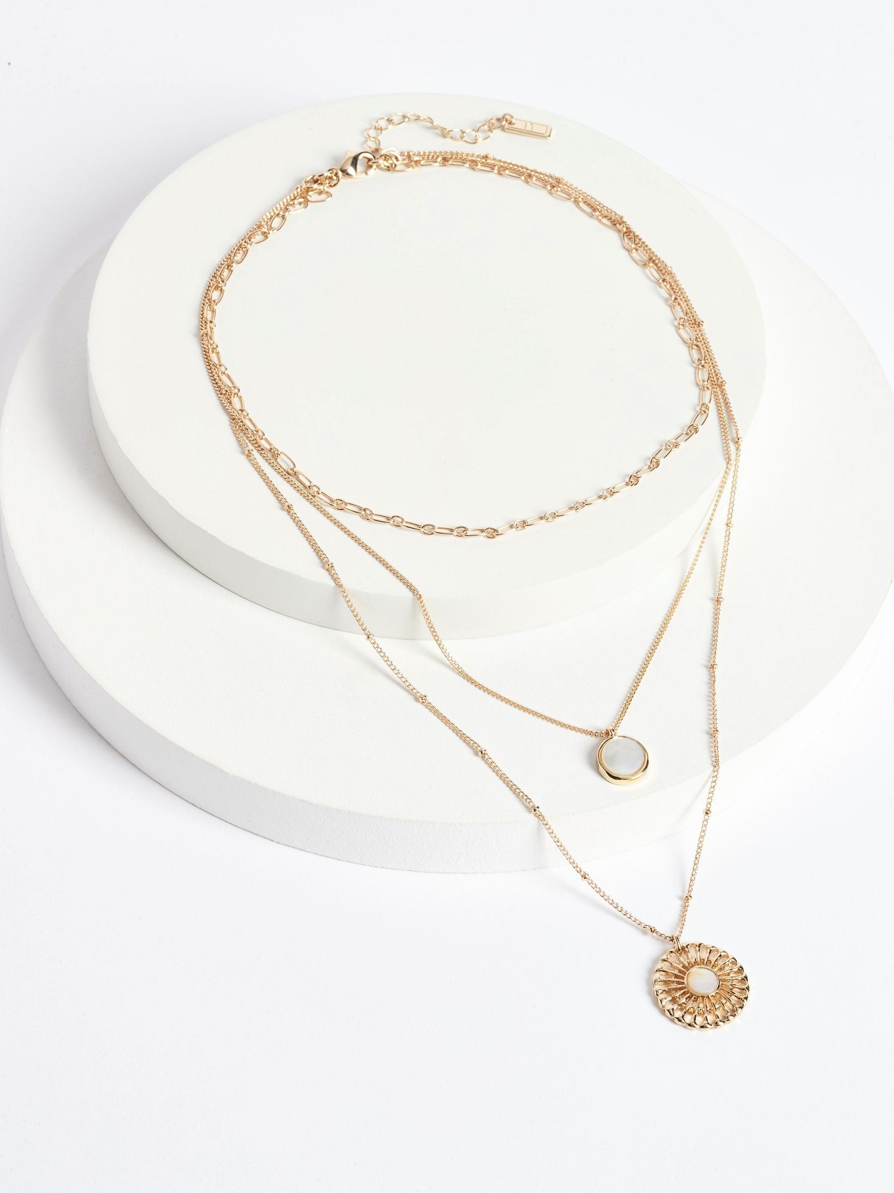 Gold tone floral 3 row necklace with shell pendant, UK version