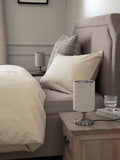 Brushed nickel Burford bedside table lamp with oatmeal shade, UK version