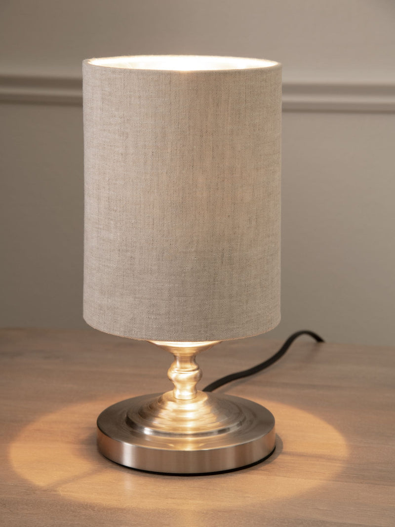 Brushed nickel Burford bedside table lamp with oatmeal shade, UK version