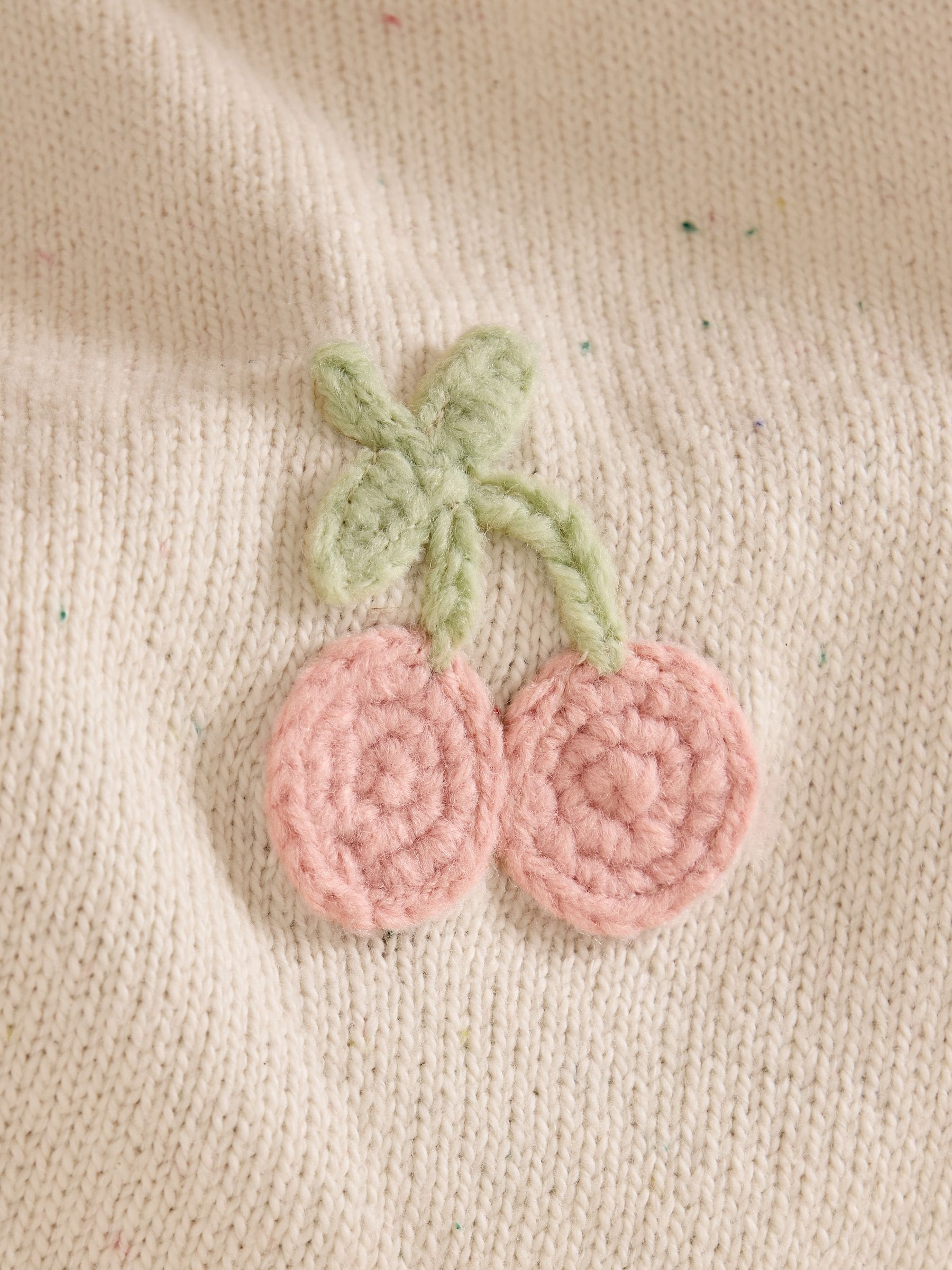 JoJo Maman Bébé knitted baby blanket with crochet fruit details, imported from the UK