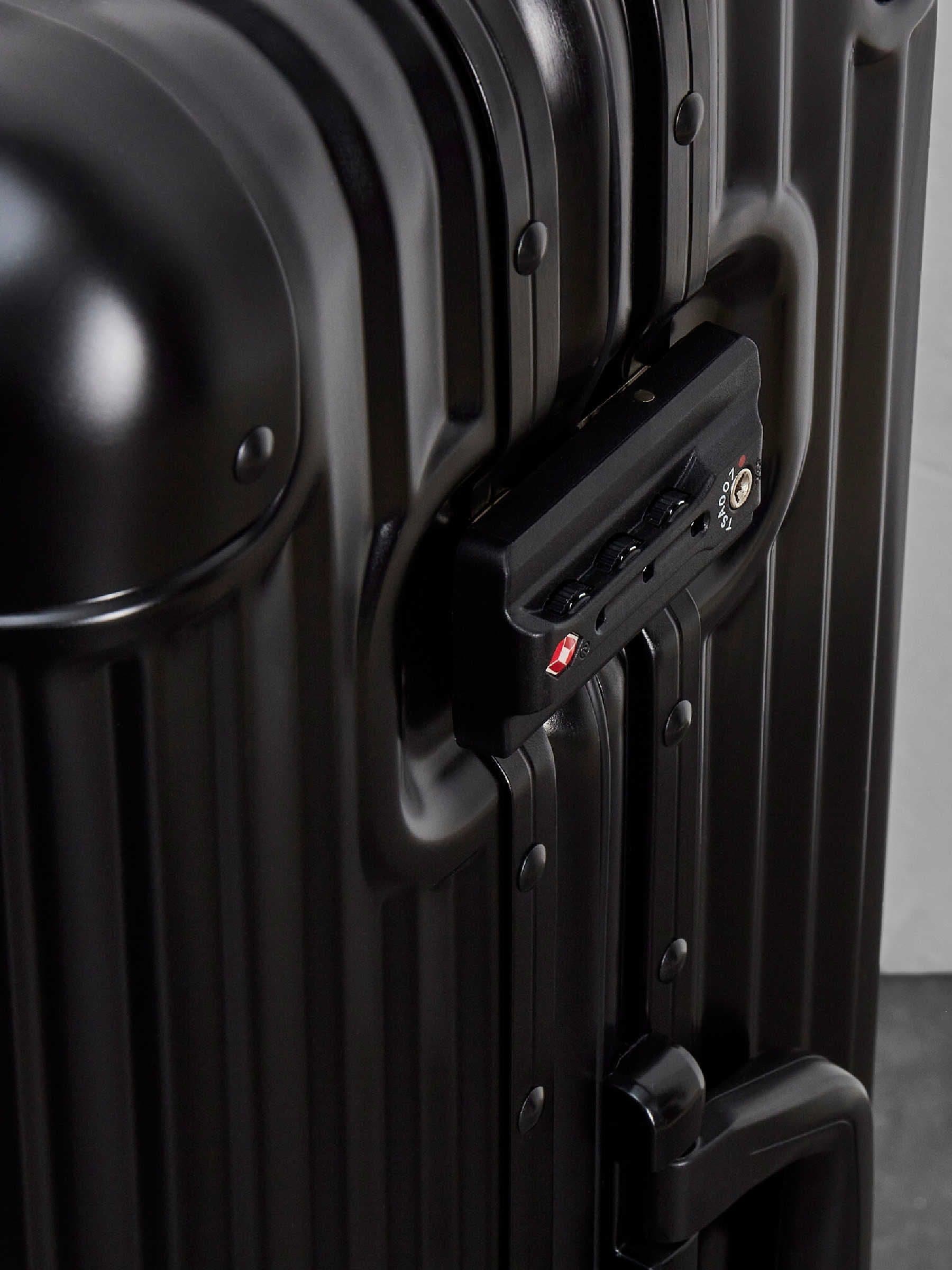 Rock Axel medium aluminium suitcase in black, imported from the UK