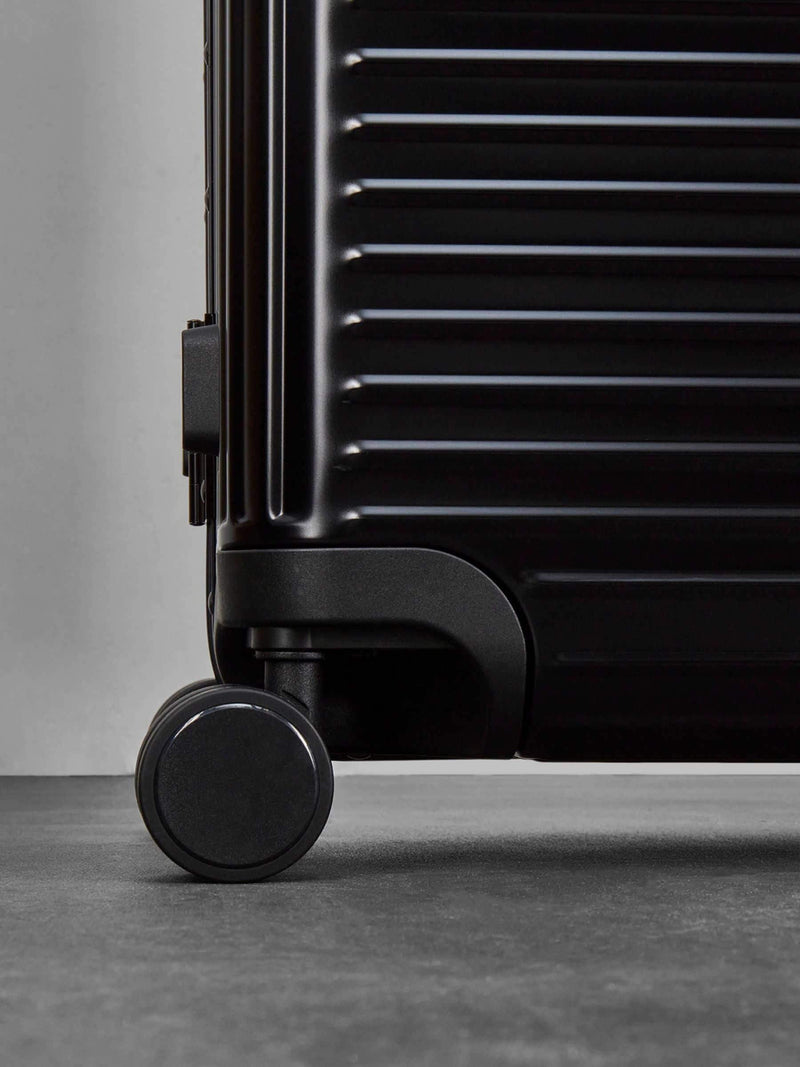 Rock Axel medium aluminium suitcase in black, imported from the UK