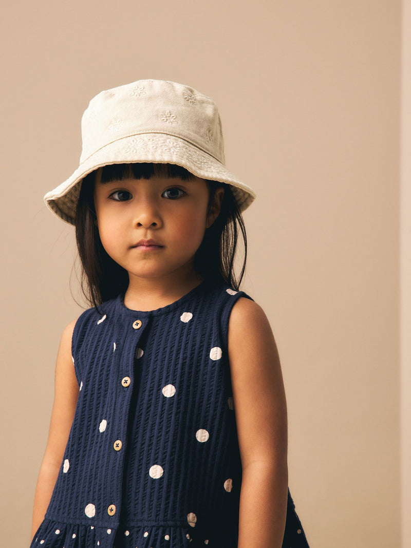 Laser cut embroidered bucket hat for children, imported from the UK