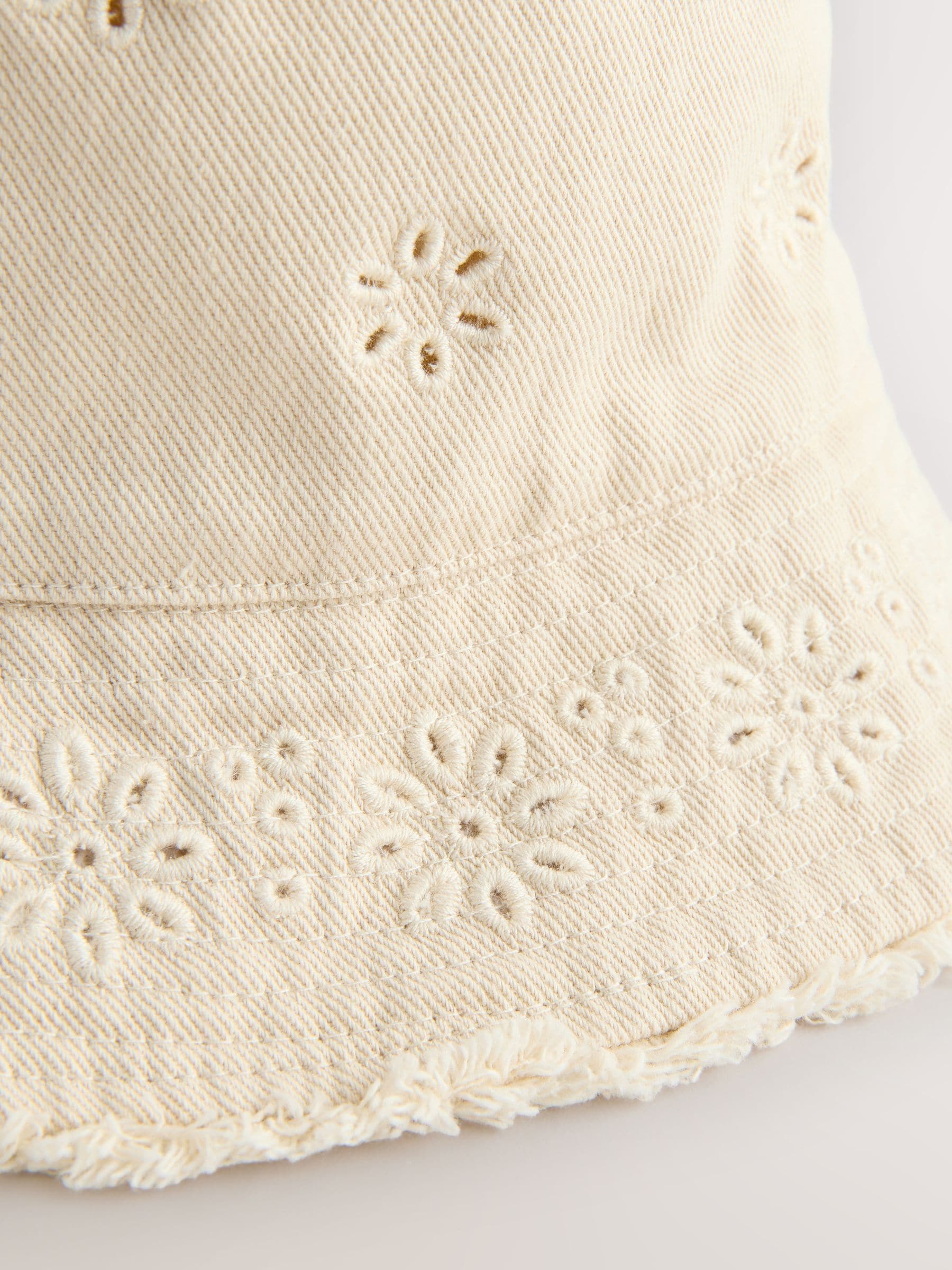 Laser cut embroidered bucket hat for children, imported from the UK