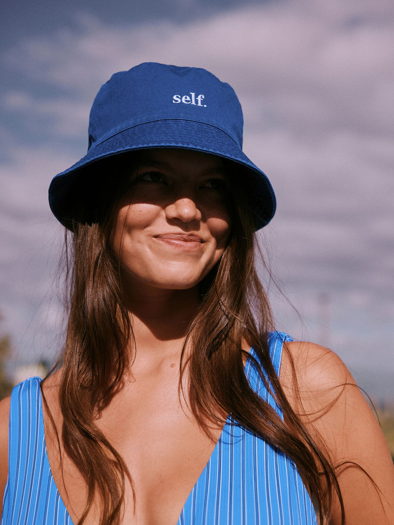 self. cobalt blue bucket hat, imported from the UK