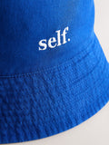 self. cobalt blue bucket hat, imported from the UK