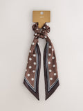 Polka dot scrunchie with tie detail in brown, UK version