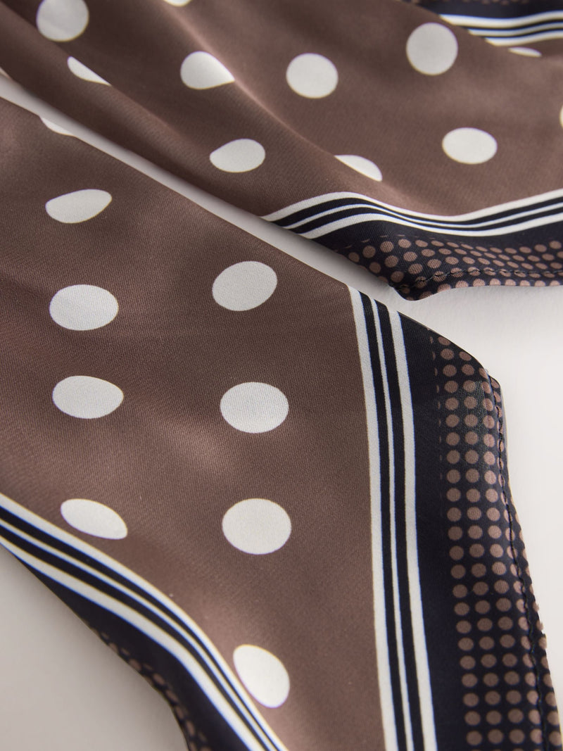Polka dot scrunchie with tie detail in brown, UK version