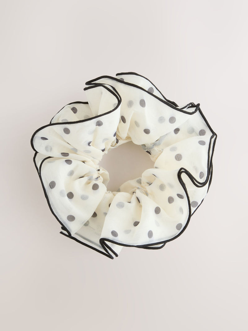 Polka dot scrunchie in white and black (British brand)