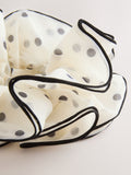 Polka dot scrunchie in white and black (British brand)
