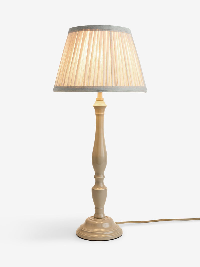 Grey Ashbury table lamp with beige base and pleated ivory shade, UK version