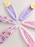 Pink heart-shaped click clacks 6 pack hair clips, UK version