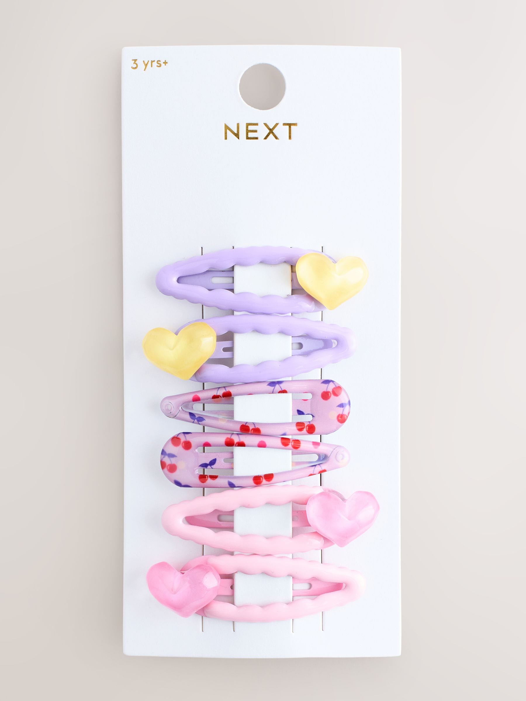 Pink heart-shaped click clacks 6 pack hair clips, UK version