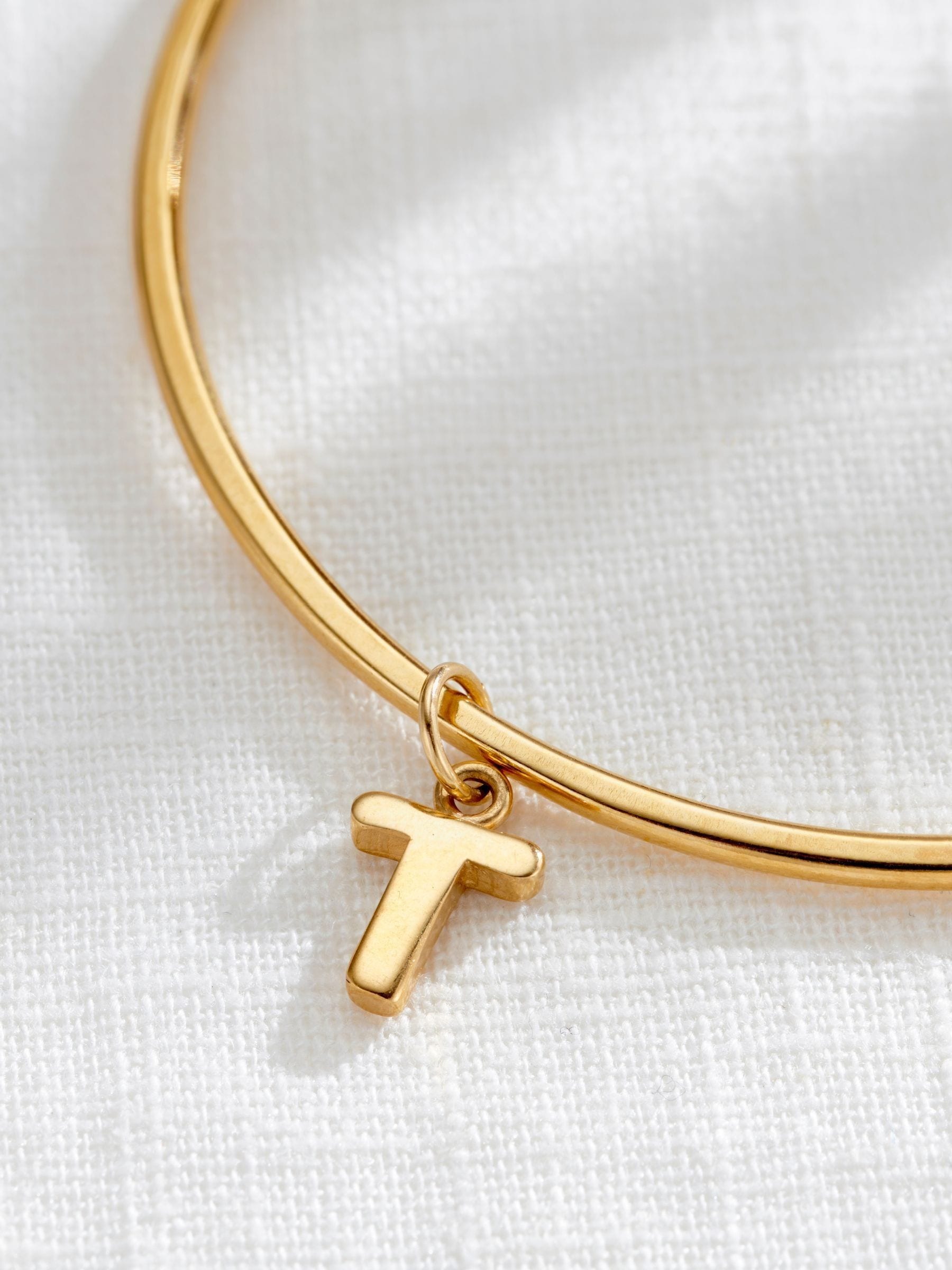 Posh Totty Designs gold tone chunky initial charm bangle, imported from the UK
