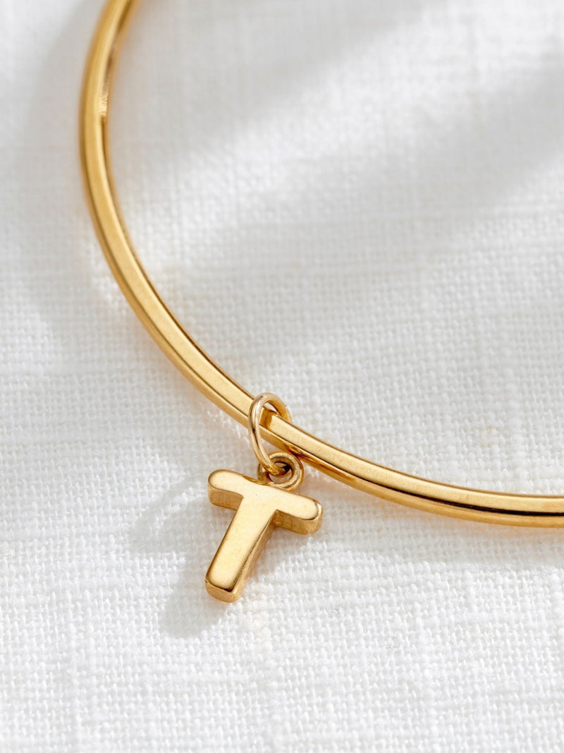 Posh Totty Designs gold tone chunky initial charm bangle, imported from the UK