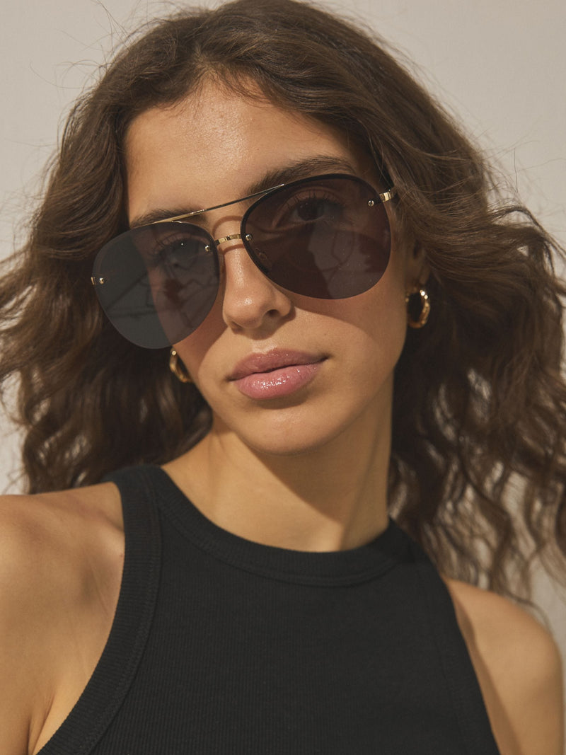 Brown aviator sunglasses with gold-tone metal frame, imported from the UK