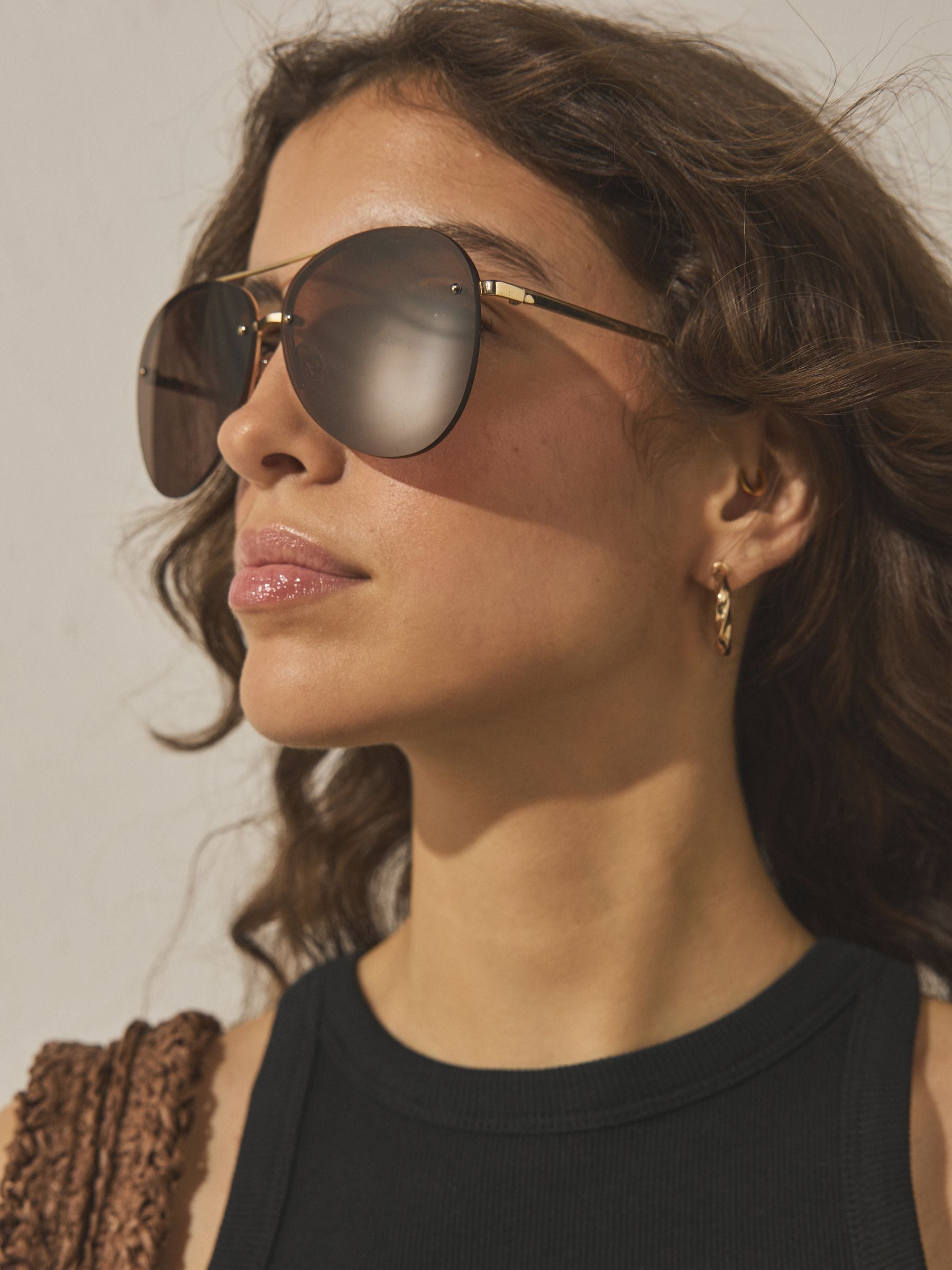 Brown aviator sunglasses with gold-tone metal frame, imported from the UK