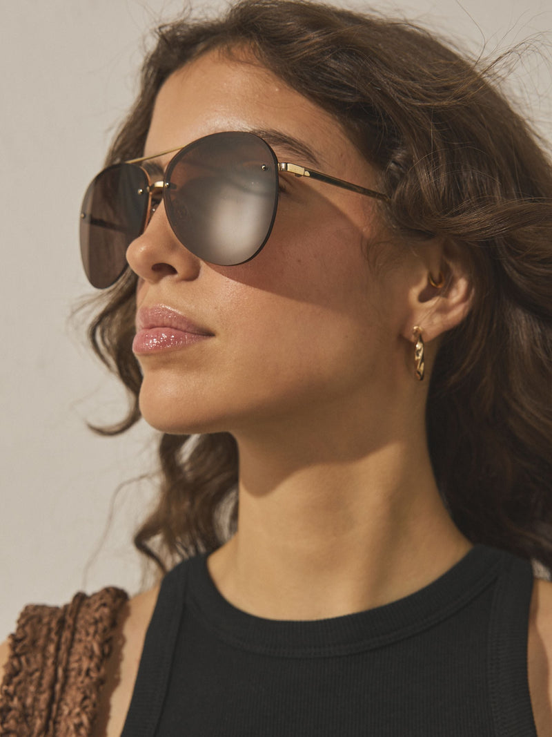 Brown aviator sunglasses with gold-tone metal frame, imported from the UK
