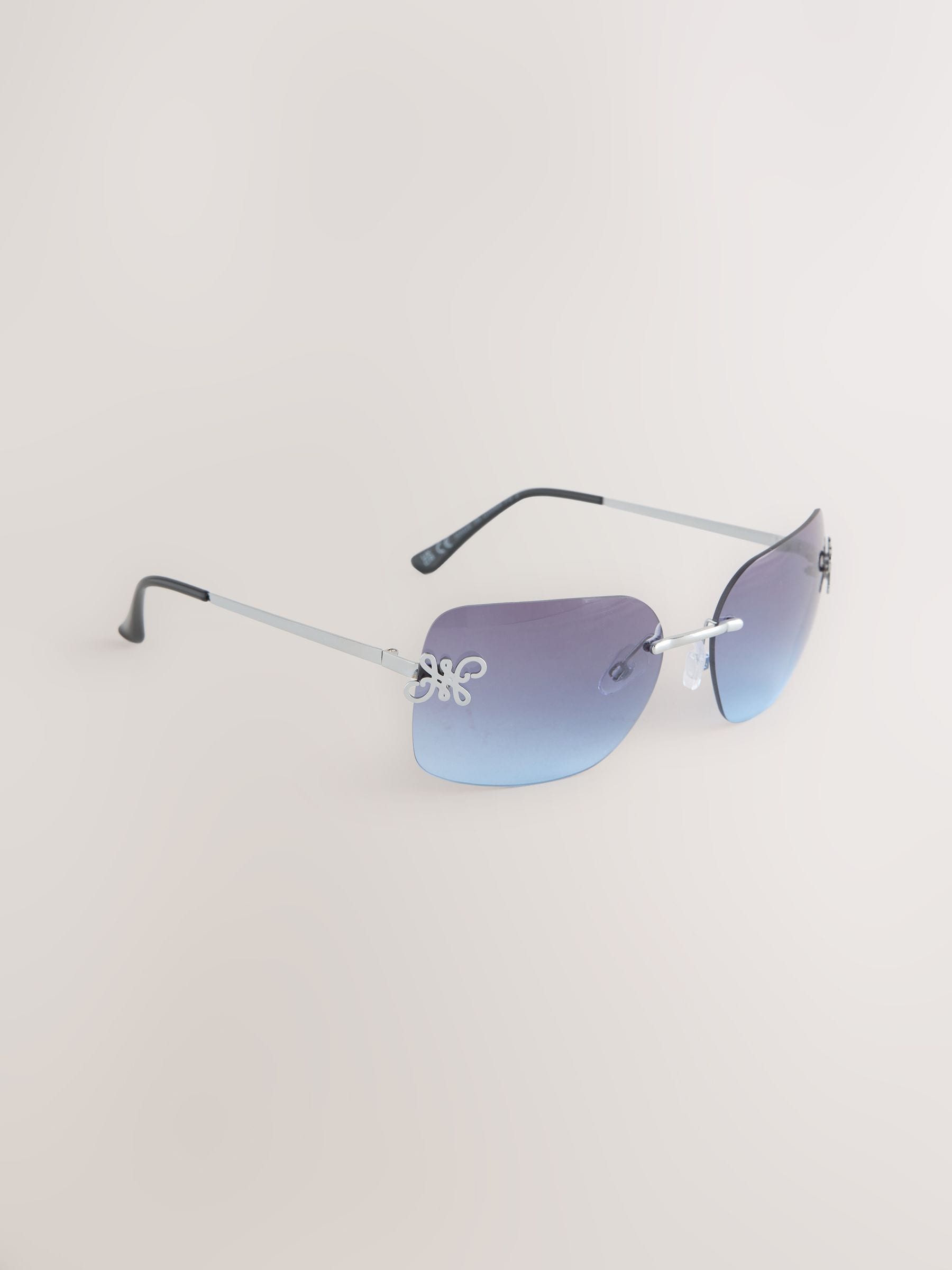 Blue wrap around sunglasses with metal frame, imported from the UK