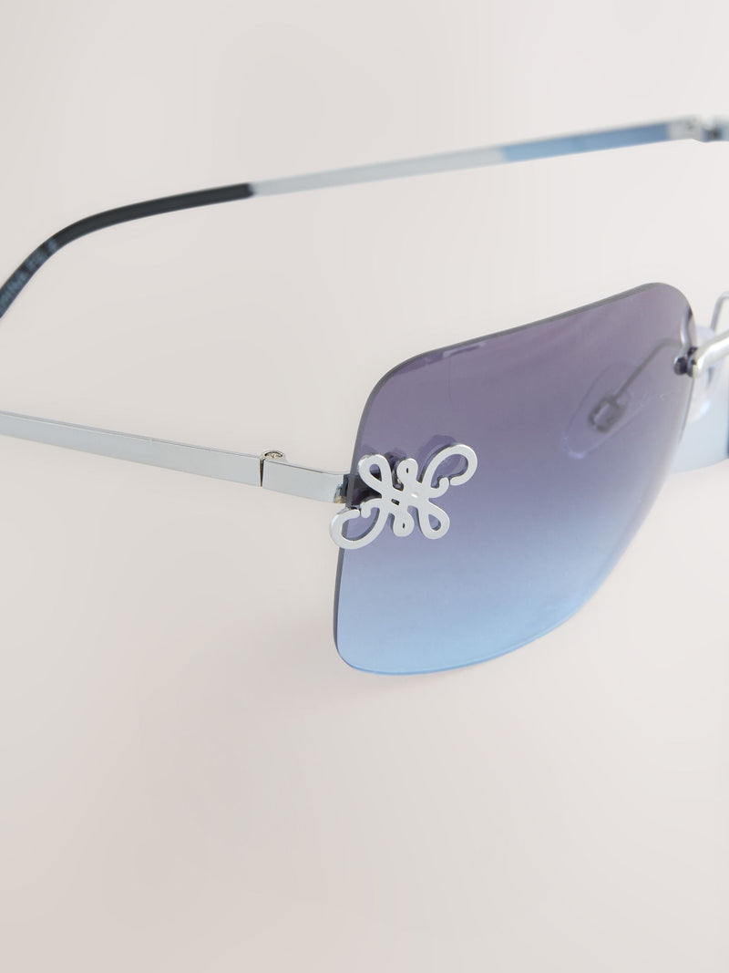 Blue wrap around sunglasses with metal frame, imported from the UK