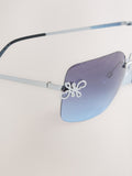 Blue wrap around sunglasses with metal frame, imported from the UK