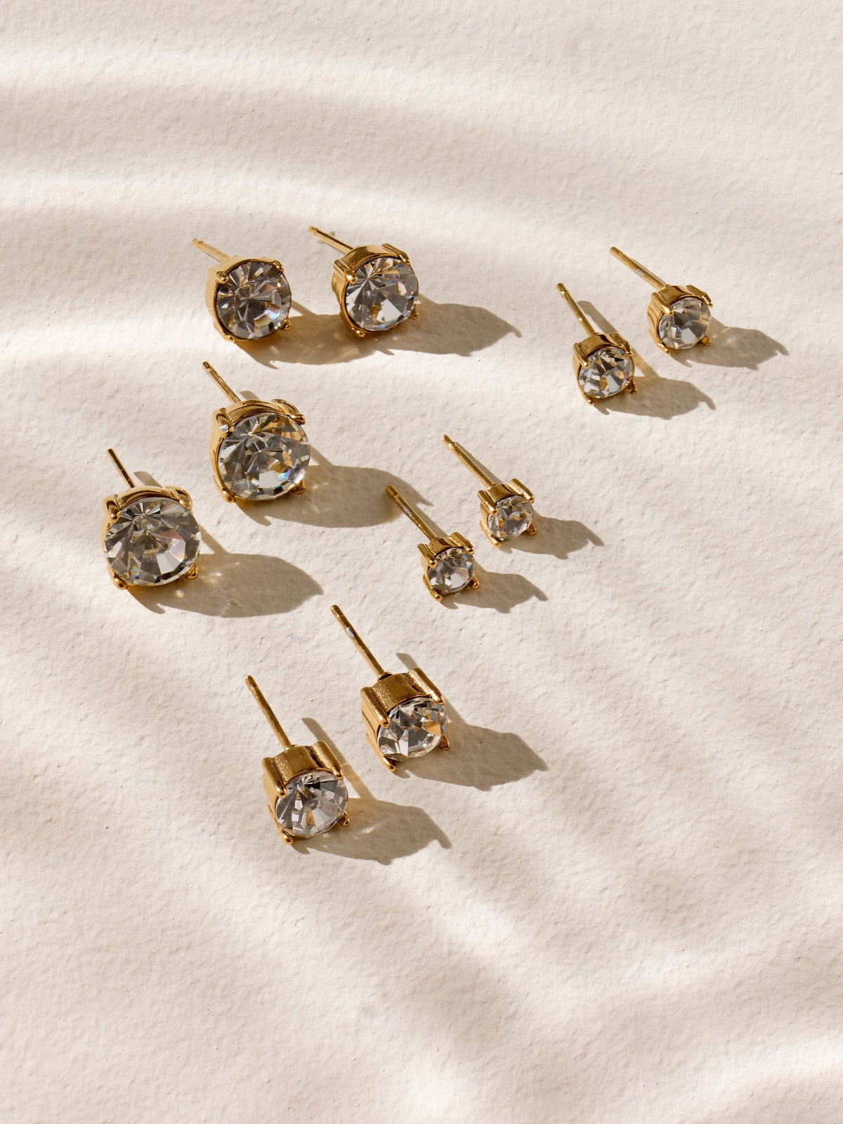 Gold tone stainless steel sparkle stud earrings 5-pack, imported from the UK